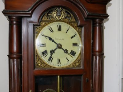 Grandfather clock before restoration - worn and damaged