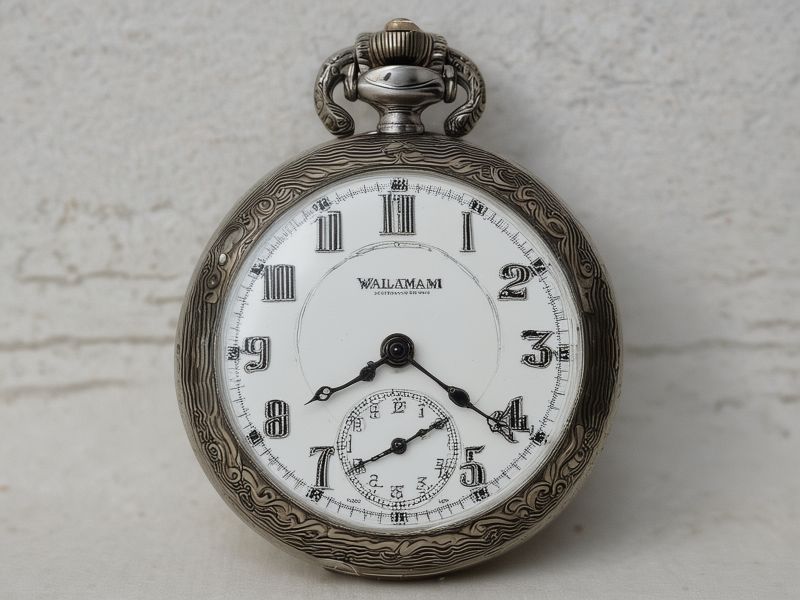 Vintage pocket watch restoration - intricate engravings and movement precision work